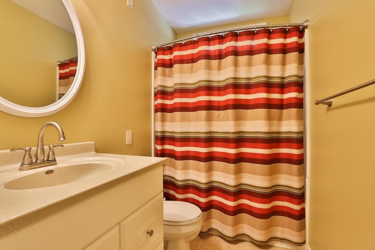 1035 North Indiana Street Griffith, IN 46319 - Photo 7 of 10 a bathroom with a sink and a mirror