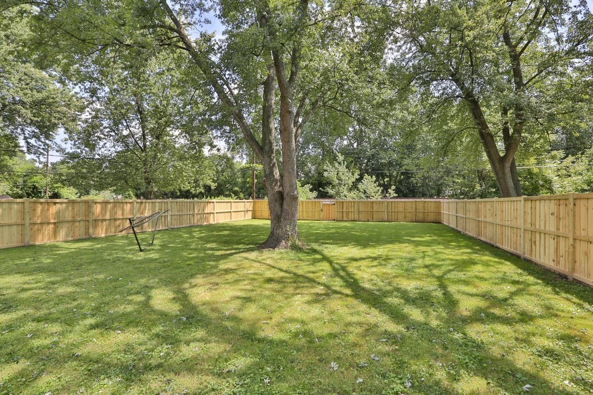 1035 North Indiana Street Griffith, IN 46319 - Photo 10 of 10 a view of a yard with a house and large trees