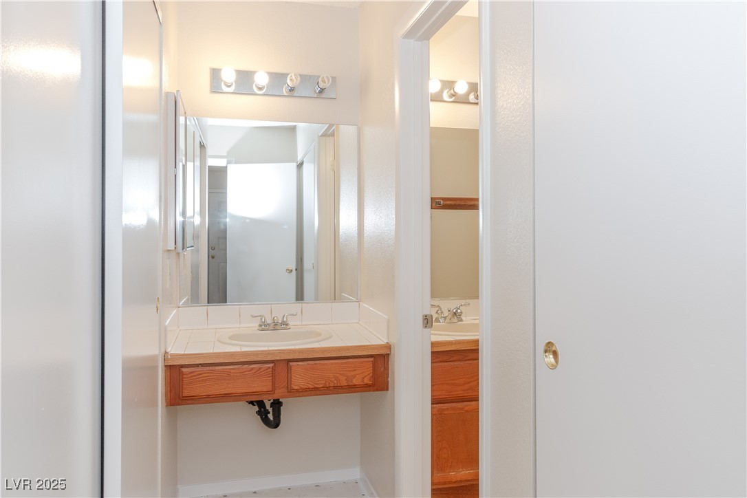 2225 Pebble Creek Lane Laughlin, NV 89029 - Photo 24 of 87 Primary Ensuite Bathroom with vanity