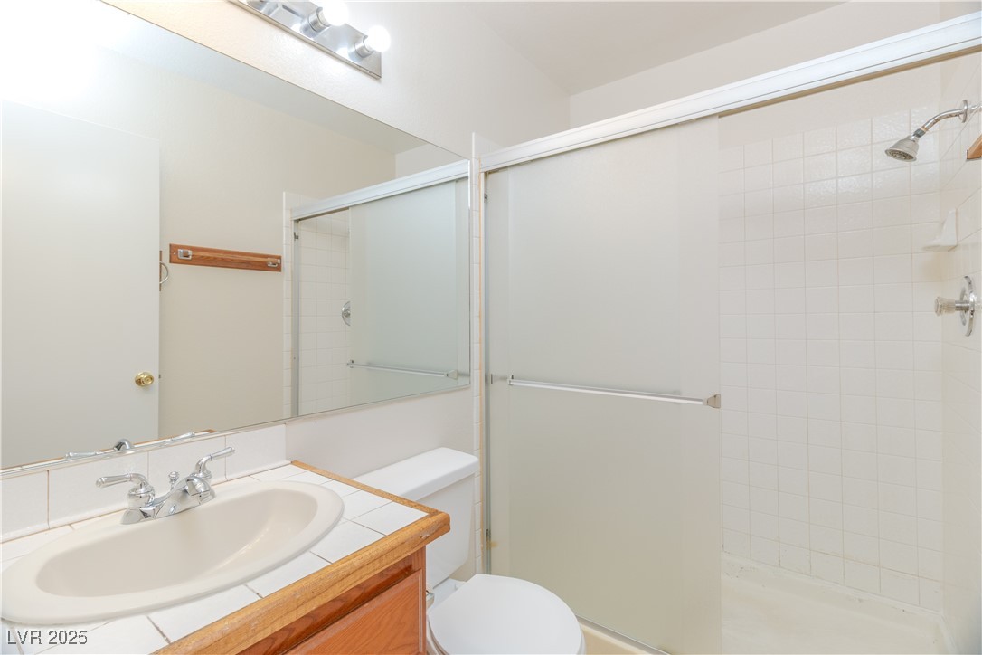 2225 Pebble Creek Lane Laughlin, NV 89029 - Photo 26 of 87 Full Primary bath featuring vanity and a shower stall