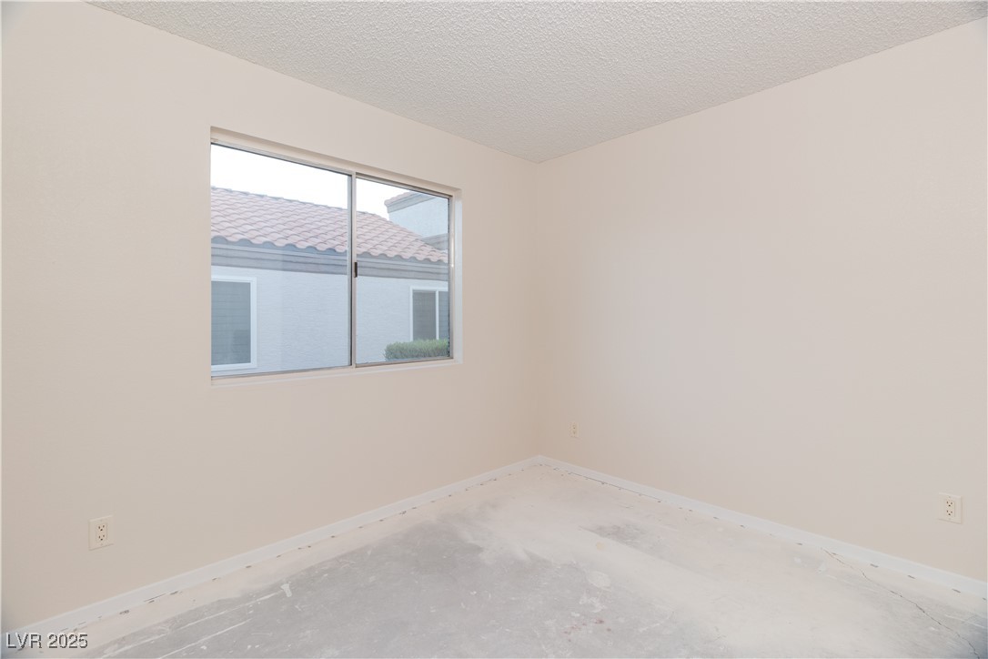 2225 Pebble Creek Lane Laughlin, NV 89029 - Photo 35 of 87 Third room featuring baseboards and a textured ceiling