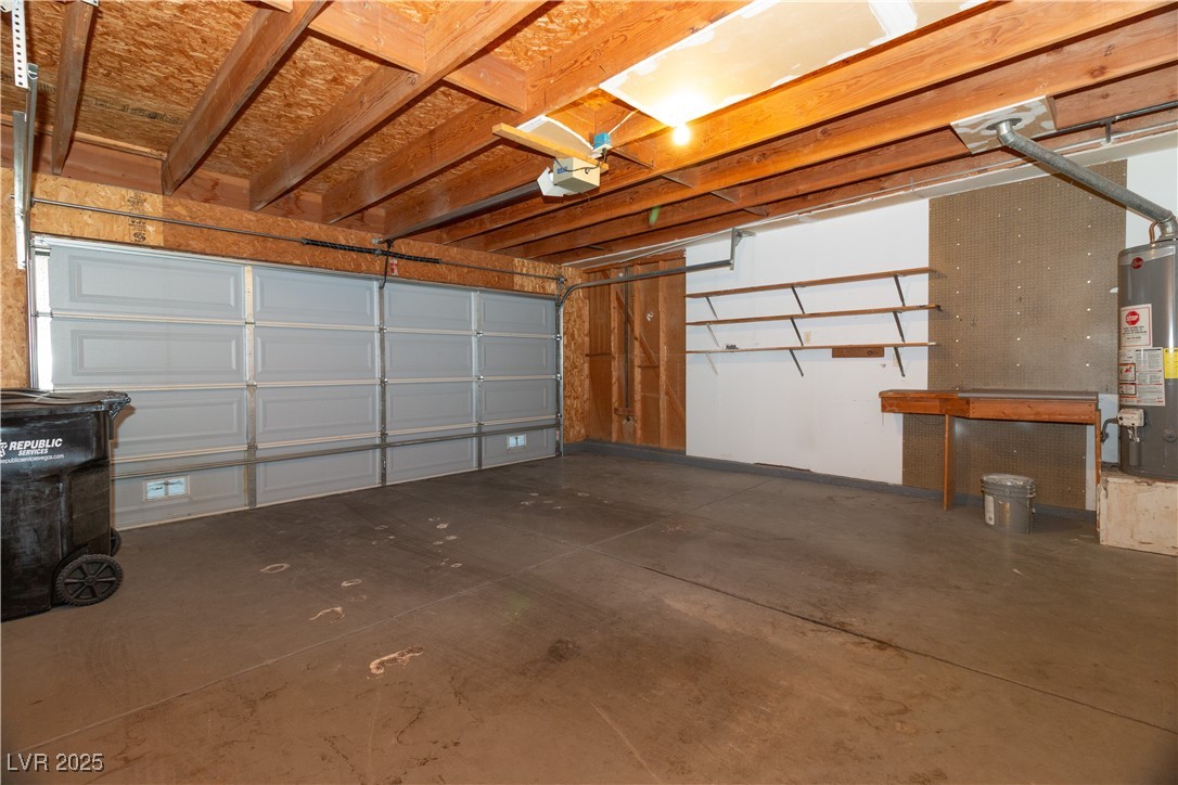 2225 Pebble Creek Lane Laughlin, NV 89029 - Photo 39 of 87 2 Car Garage featuring gas water heater and a garage door opener