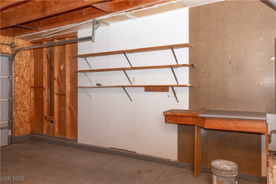 2225 Pebble Creek Lane Laughlin, NV 89029 - Photo 40 of 87 View of 2 Car garage with workshop bench and storage shelving