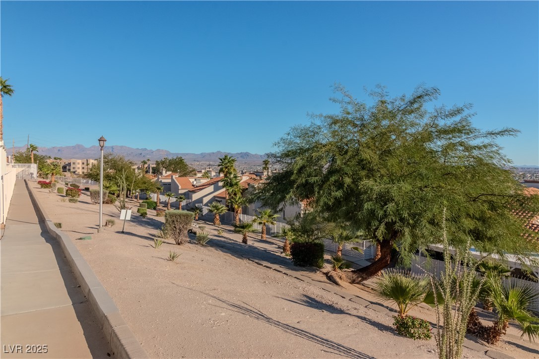 2225 Pebble Creek Lane Laughlin, NV 89029 - Photo 45 of 87 View of road featuring street lighting, a mountain view, and a residential view