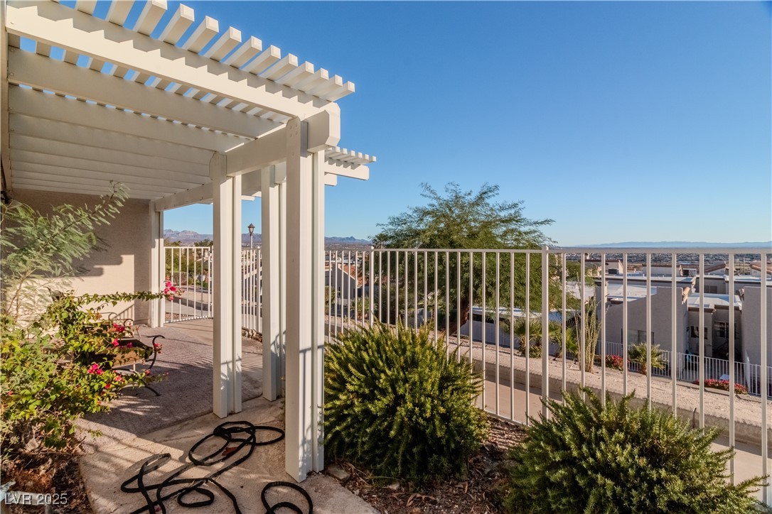2225 Pebble Creek Lane Laughlin, NV 89029 - Photo 62 of 87 View of patio featuring a pergola and a mountain view