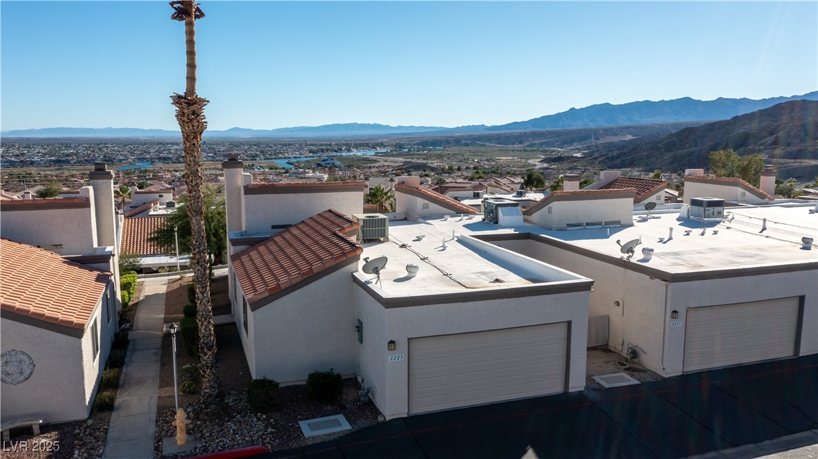 2225 Pebble Creek Lane Laughlin, NV 89029 - Photo 64 of 87 View of front of house featuring a mountain view, stucco siding, and a patio area