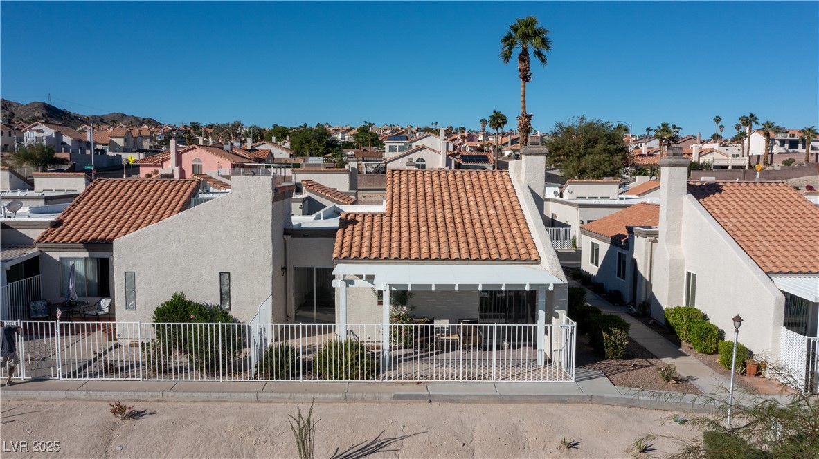 2225 Pebble Creek Lane Laughlin, NV 89029 - Photo 69 of 87 View of back of house featuring a mountain view, stucco siding, and a patio area