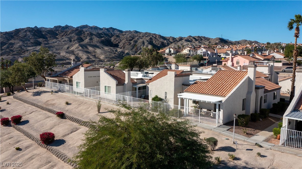 2225 Pebble Creek Lane Laughlin, NV 89029 - Photo 77 of 87 View of back of house featuring a mountain view, stucco siding, and a patio area