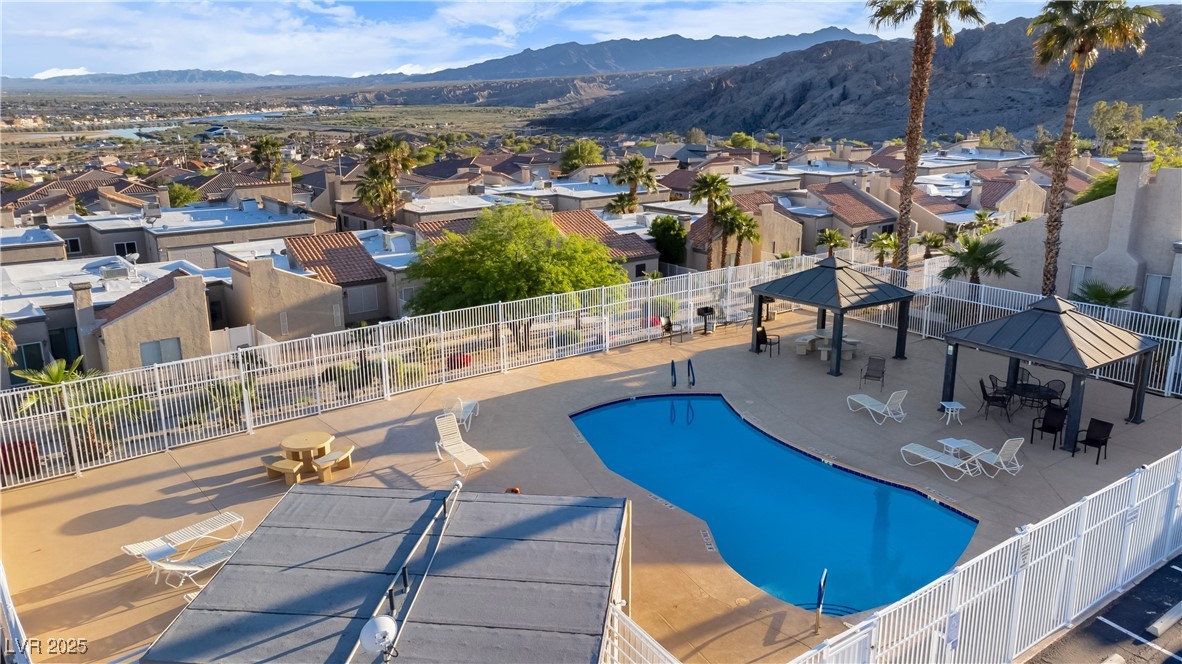 2225 Pebble Creek Lane Laughlin, NV 89029 - Photo 85 of 87 Community pool with a gazebo, a mountain view, a residential view, and a patio