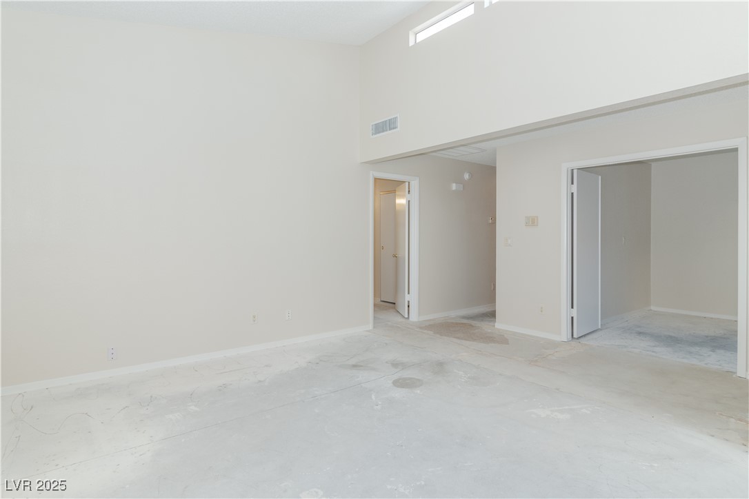 2225 Pebble Creek Lane Laughlin, NV 89029 - Photo 9 of 87 Living room with a towering ceiling and baseboards