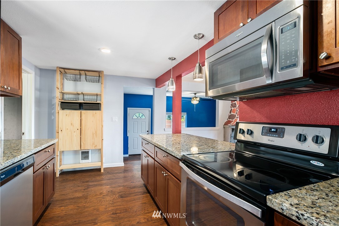 23925 7th Avenue West Bothell, WA 98021 - Photo 11 of 28 a kitchen with stainless steel appliances granite countertop a stove and a microwave