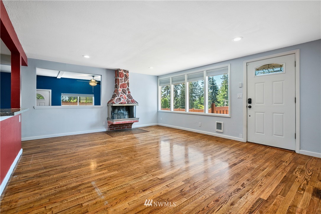 23925 7th Avenue West Bothell, WA 98021 - Photo 17 of 28 an empty room with wooden floor and windows