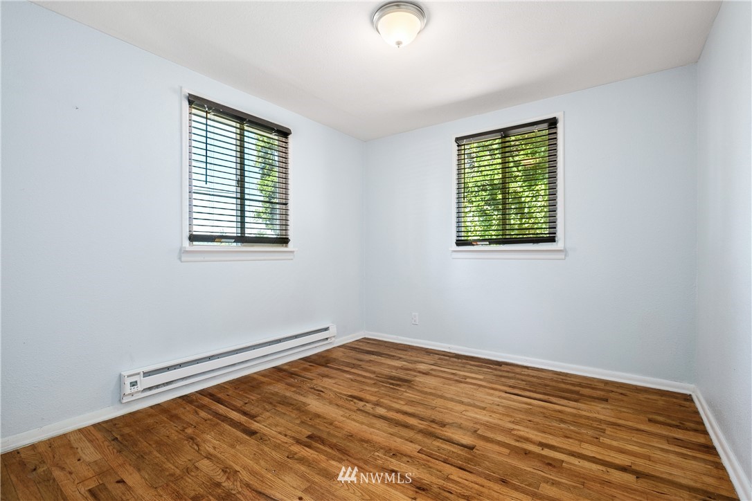 23925 7th Avenue West Bothell, WA 98021 - Photo 19 of 28 an empty room with wooden floor and windows