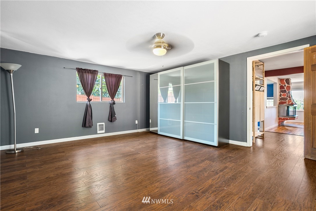 23925 7th Avenue West Bothell, WA 98021 - Photo 20 of 28 an empty room with wooden floor and windows