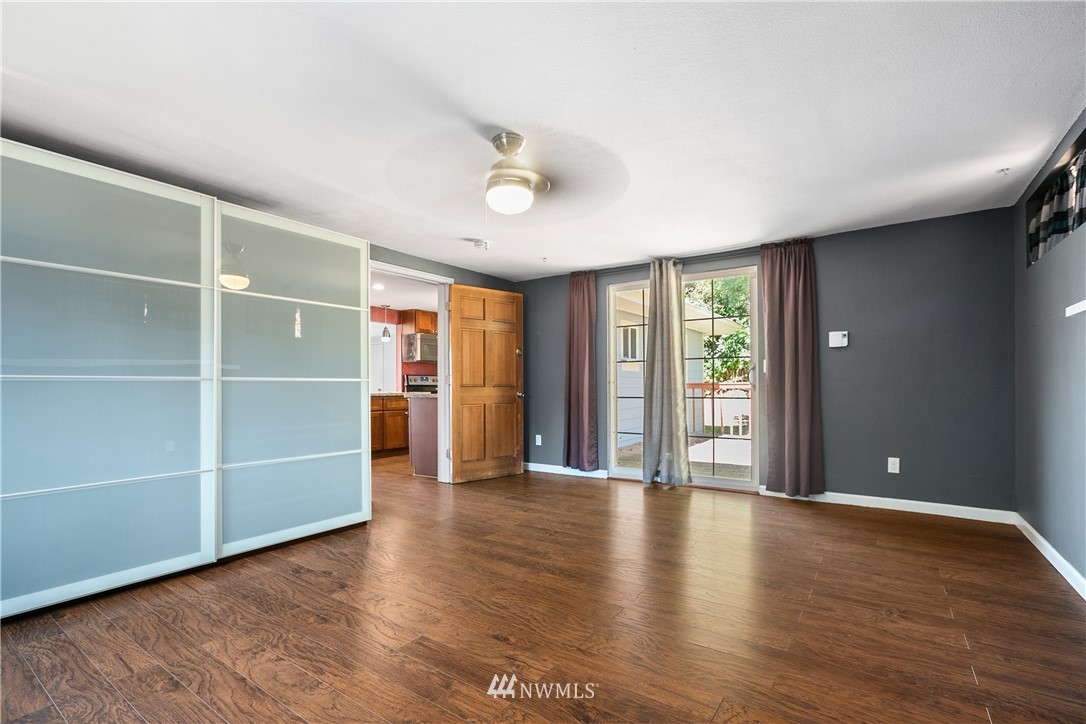 23925 7th Avenue West Bothell, WA 98021 - Photo 21 of 28 a view of an empty room with a window and wooden floor