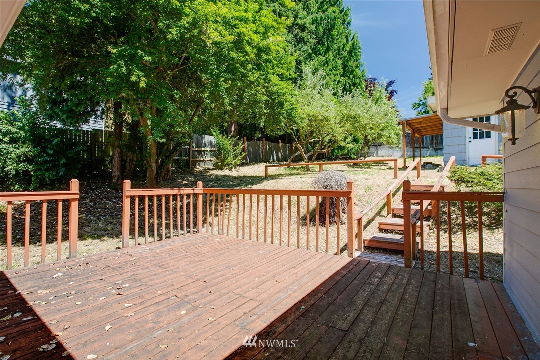 23925 7th Avenue West Bothell, WA 98021 - Photo 23 of 28 a balcony with wooden floor and fence