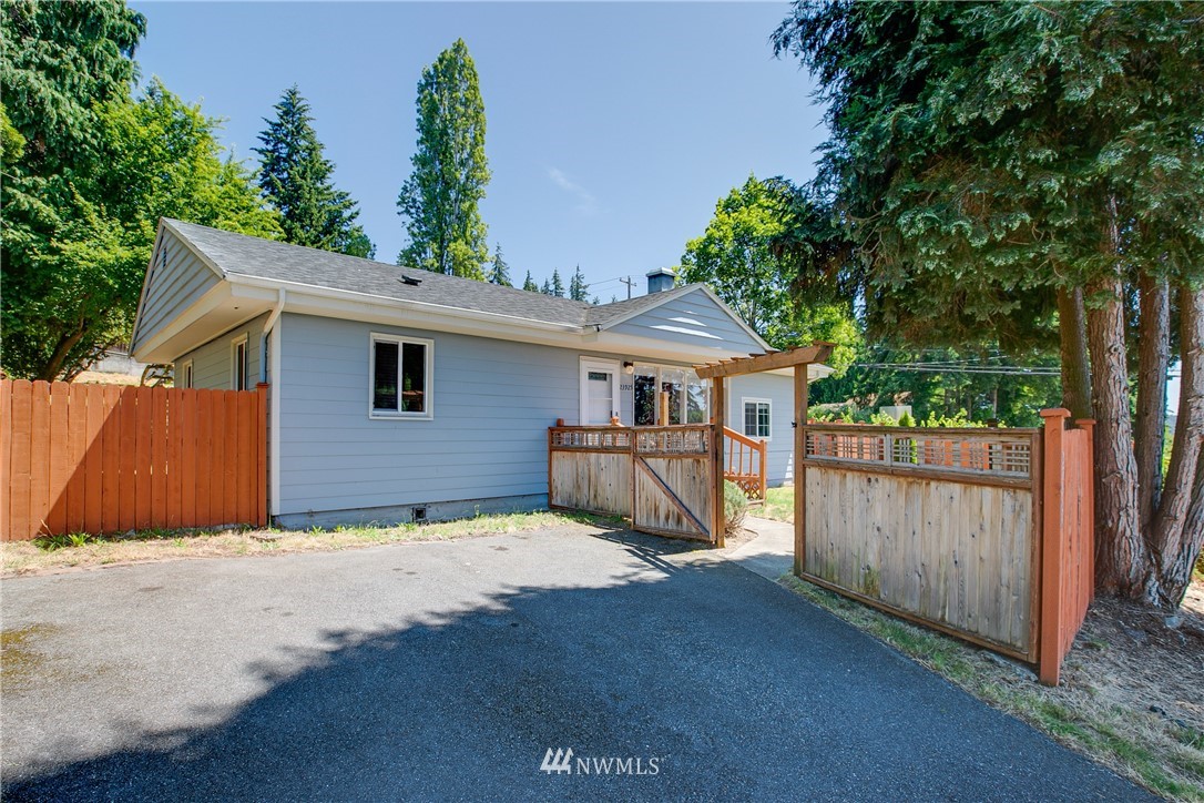 23925 7th Avenue West Bothell, WA 98021 - Photo 28 of 28 a view of backyard with wooden fence and large trees