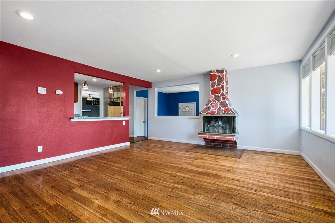 23925 7th Avenue West Bothell, WA 98021 - Photo 5 of 28 a view of an empty room with window and wooden floor