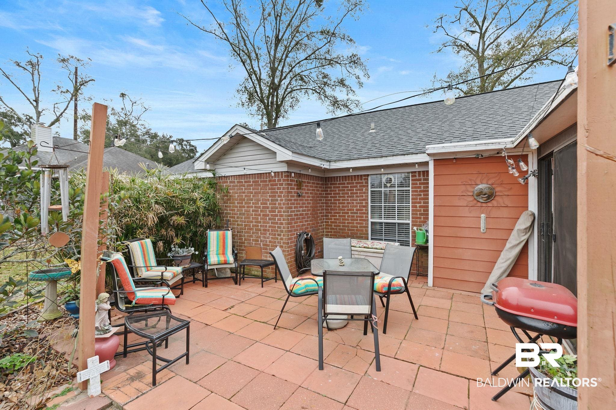 519 Juniper Place Drive Foley, AL 36535 - Photo 33 of 47 View of patio with outdoor dining area and grilling area