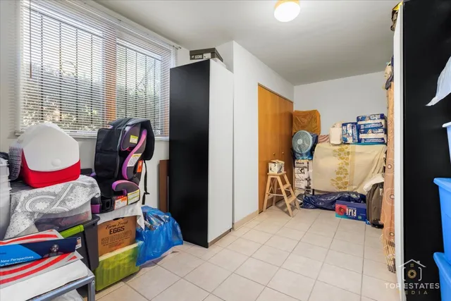 a living room filled with furniture and a flat screen tv