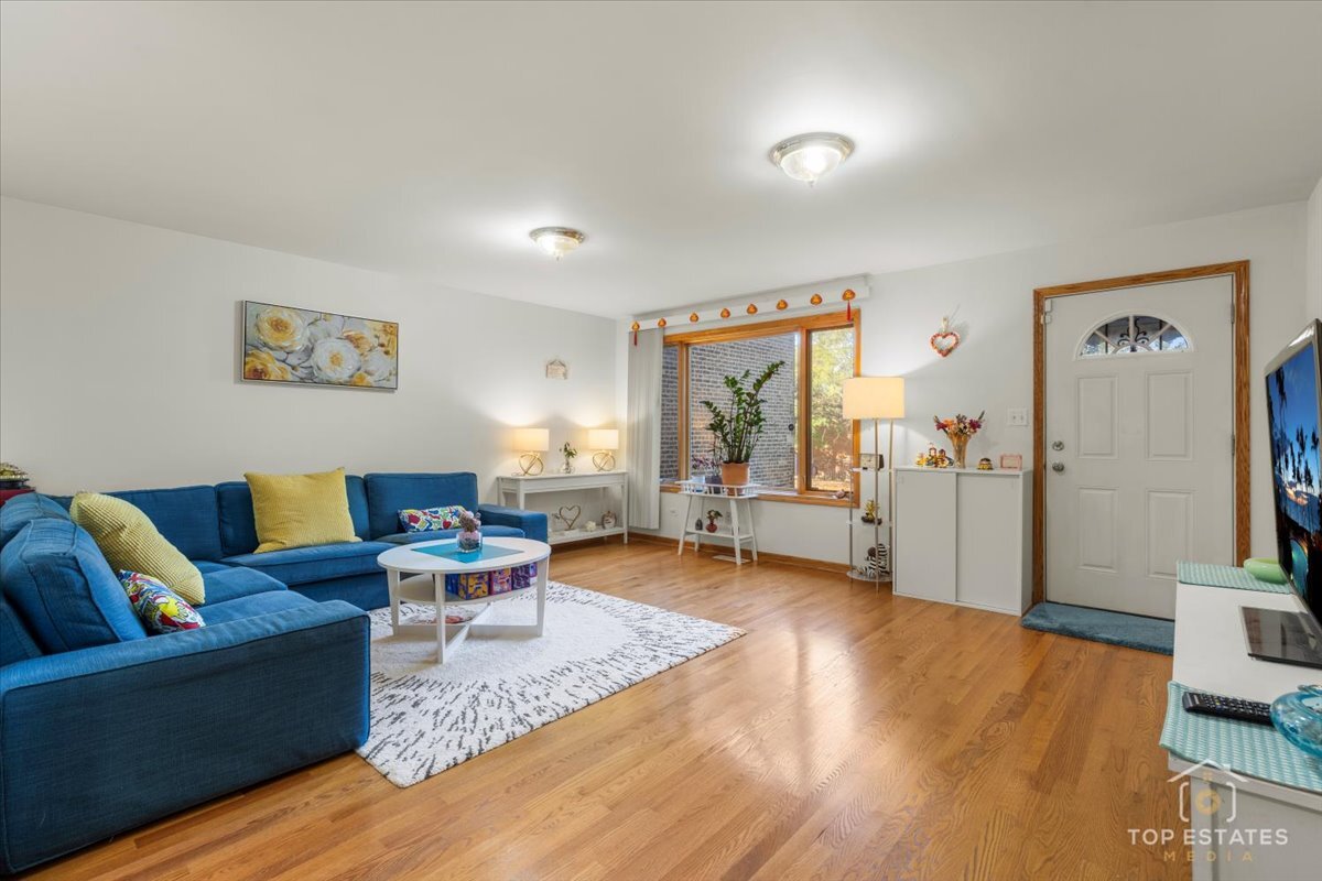 4629 South Laflin Street Chicago, IL 60609 - Photo 5 of 33 a living room with furniture and a wooden floor