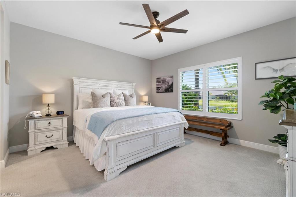 2298 Marquesa Circle Naples, FL 34112 - Photo 11 of 50 a bed room with a bed and a potted plant