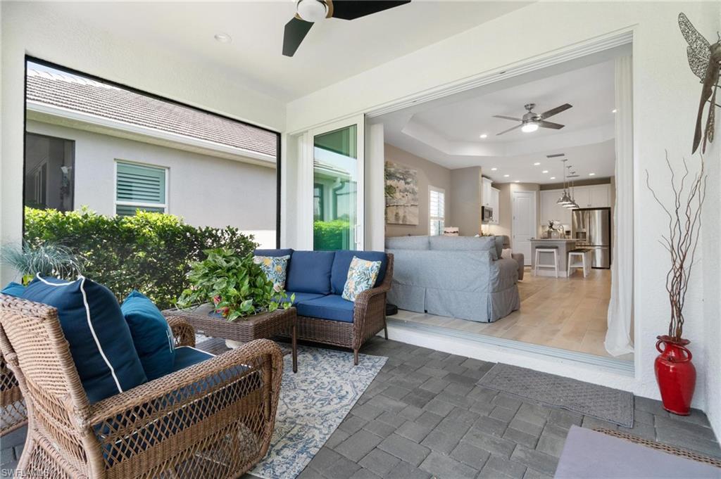 2298 Marquesa Circle Naples, FL 34112 - Photo 25 of 50 a living room with furniture and a large window