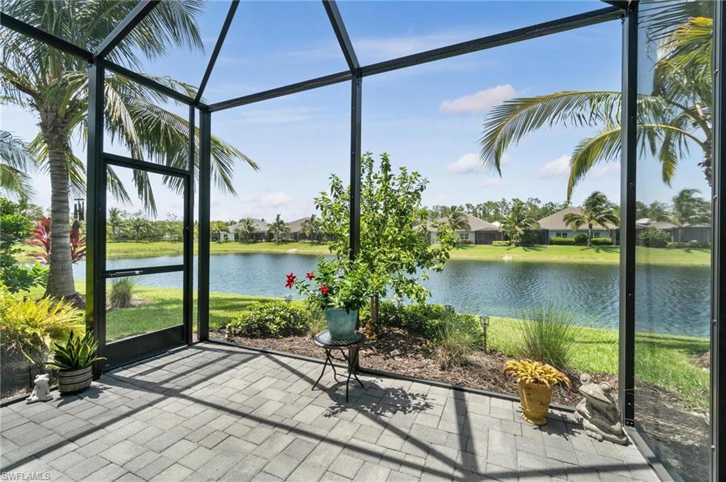 2298 Marquesa Circle Naples, FL 34112 - Photo 27 of 50 a view of a swimming pool with a patio