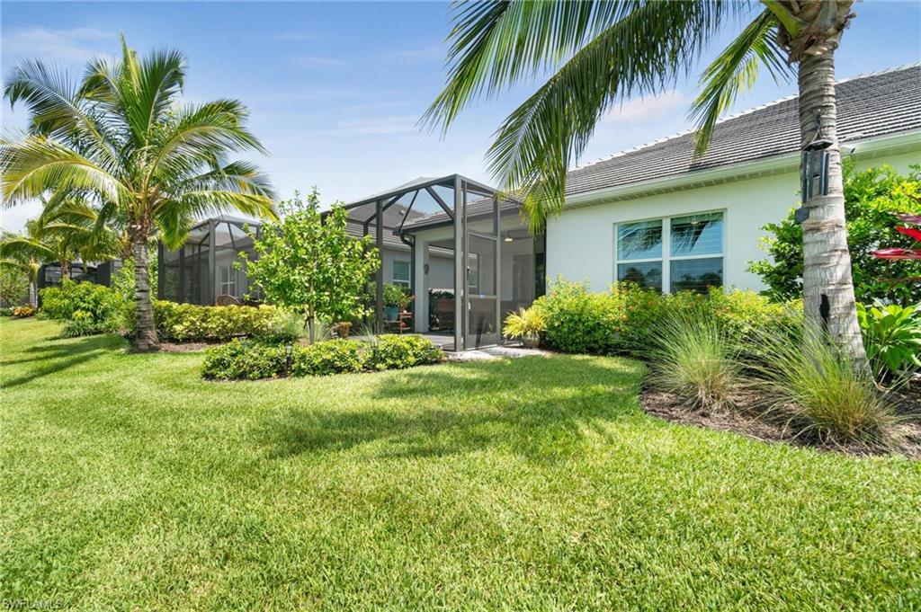 2298 Marquesa Circle Naples, FL 34112 - Photo 31 of 50 a view of a house with a yard and plants