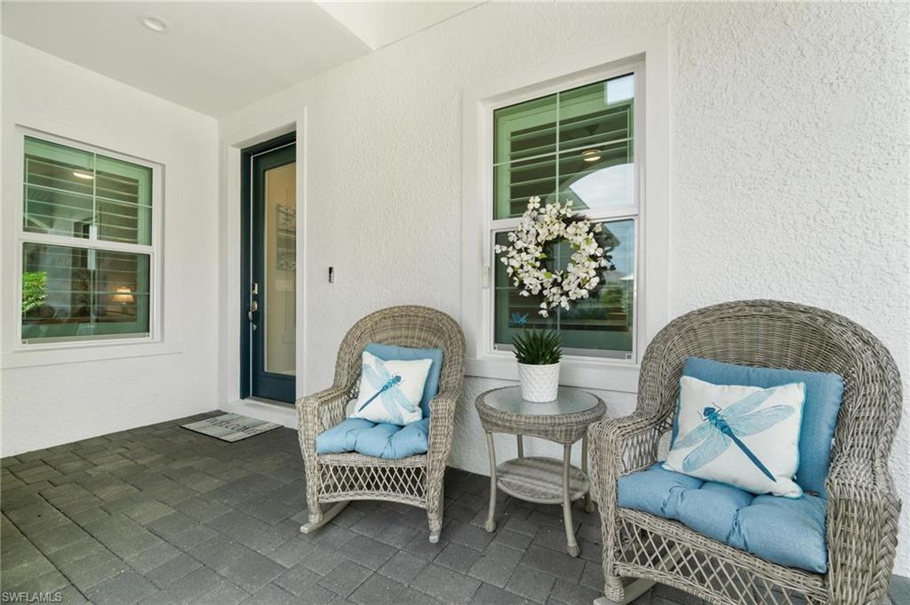 2298 Marquesa Circle Naples, FL 34112 - Photo 34 of 50 a living room with furniture and a window