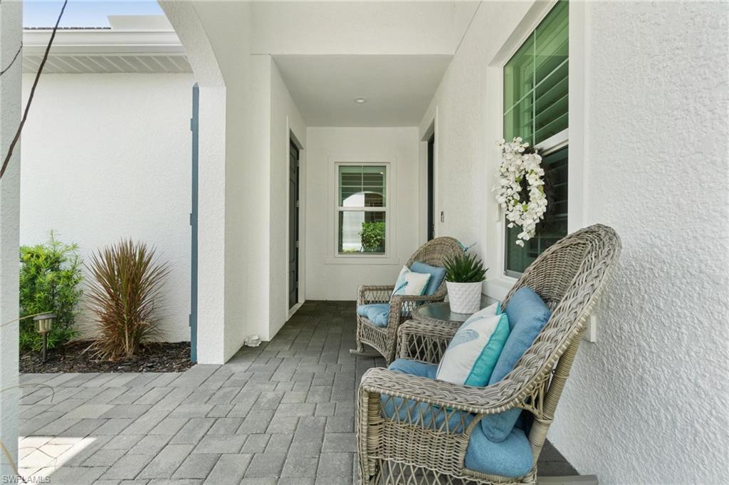 2298 Marquesa Circle Naples, FL 34112 - Photo 35 of 50 a view of a livingroom with furniture and a potted plant