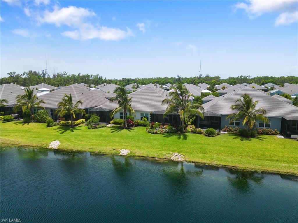 2298 Marquesa Circle Naples, FL 34112 - Photo 37 of 50 view of a lake with houses in the background