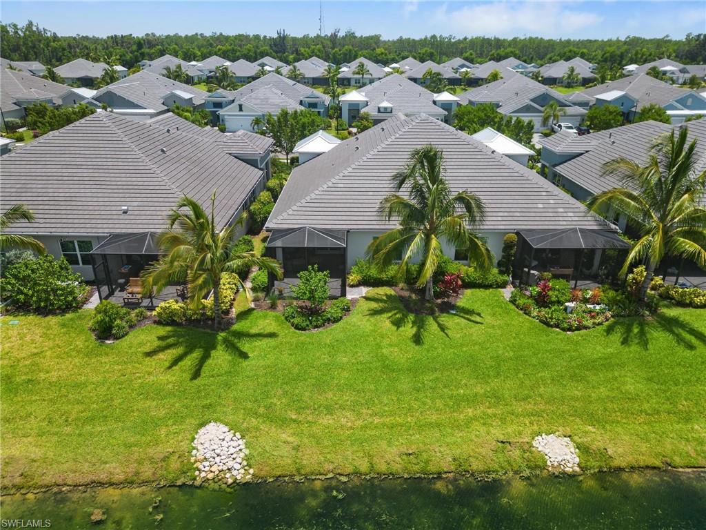 2298 Marquesa Circle Naples, FL 34112 - Photo 38 of 50 an aerial view of multiple house houses with outdoor space