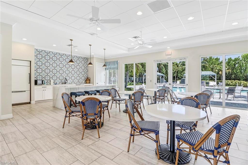 2298 Marquesa Circle Naples, FL 34112 - Photo 42 of 50 a dining room with furniture and window