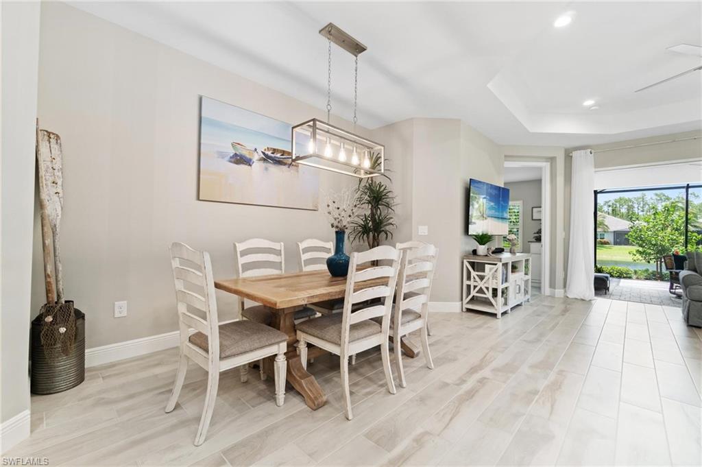 2298 Marquesa Circle Naples, FL 34112 - Photo 7 of 50 a view of a dining room with furniture window and outside view