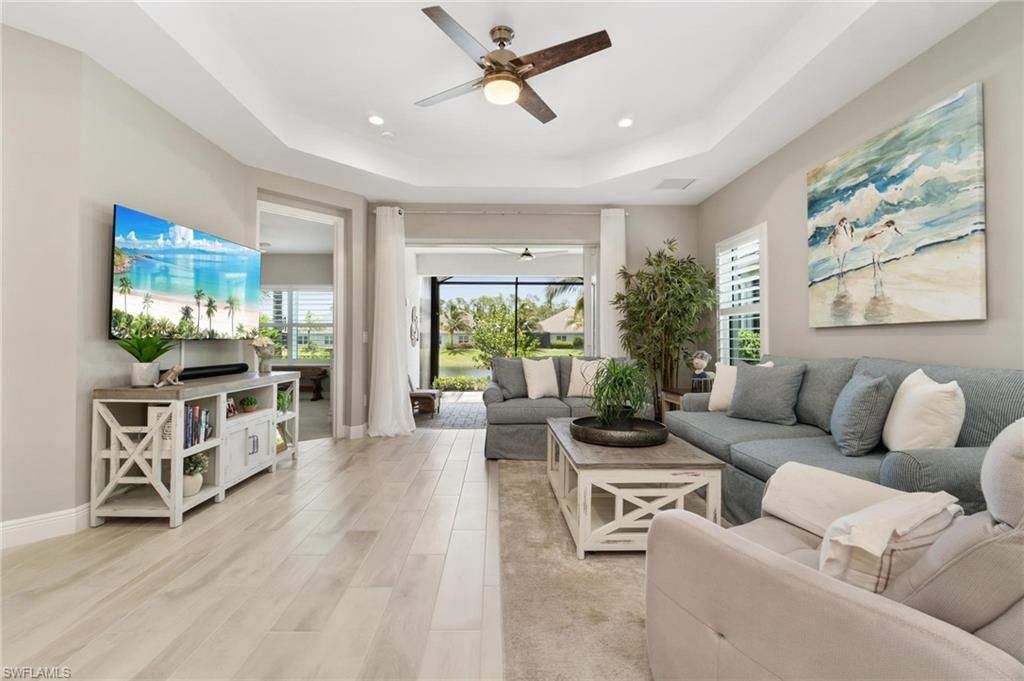 2298 Marquesa Circle Naples, FL 34112 - Photo 8 of 50 a living room with furniture and a large window