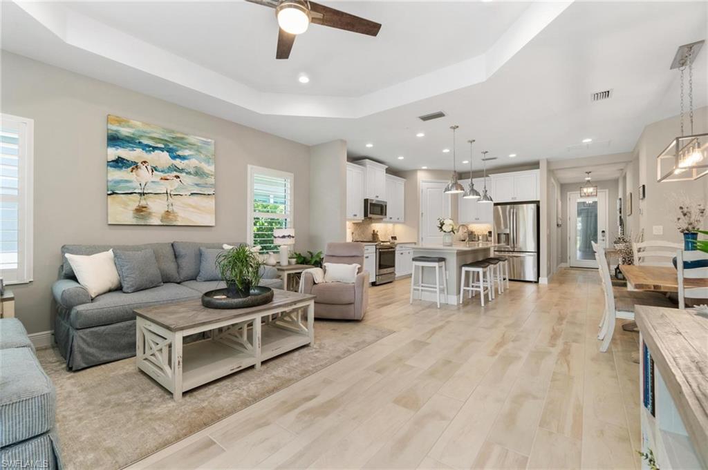 2298 Marquesa Circle Naples, FL 34112 - Photo 9 of 50 a living room with furniture and a large window