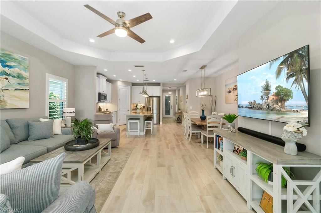 2298 Marquesa Circle Naples, FL 34112 - Photo 10 of 50 a living room with furniture and a flat screen tv