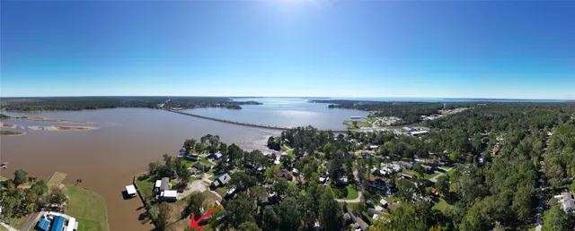 an aerial view of a houses with a lake view