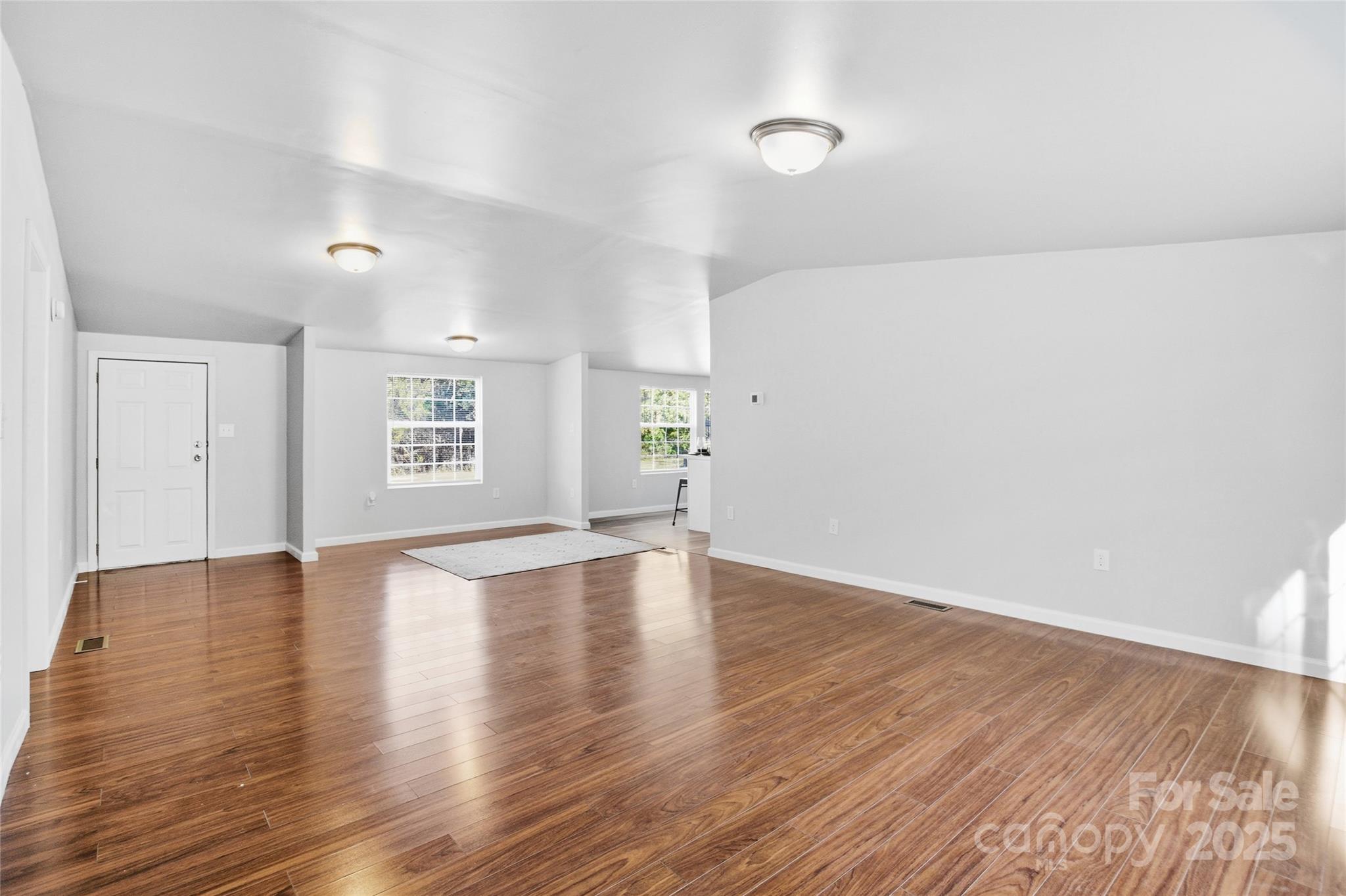 2425 Shoal Creek Church Road Shelby, NC 28152 - Photo 11 of 33 an empty room with wooden floor and windows