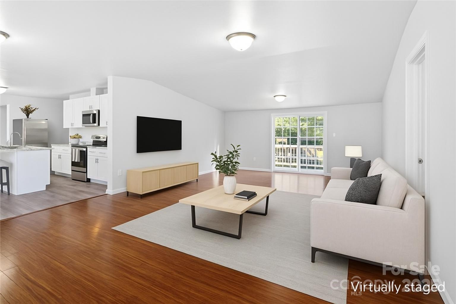 2425 Shoal Creek Church Road Shelby, NC 28152 - Photo 12 of 33 a living room with furniture flat screen tv and a large window