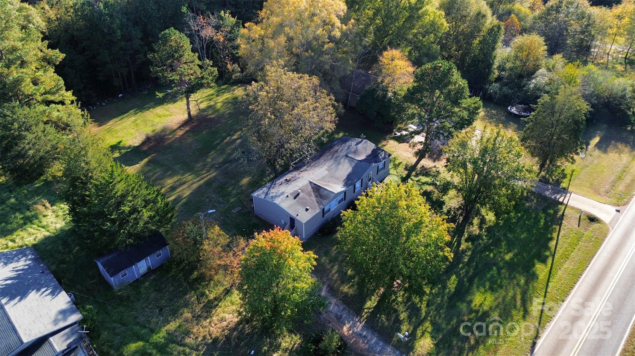 2425 Shoal Creek Church Road Shelby, NC 28152 - Photo 2 of 33 an aerial view of a house with a yard and lake view