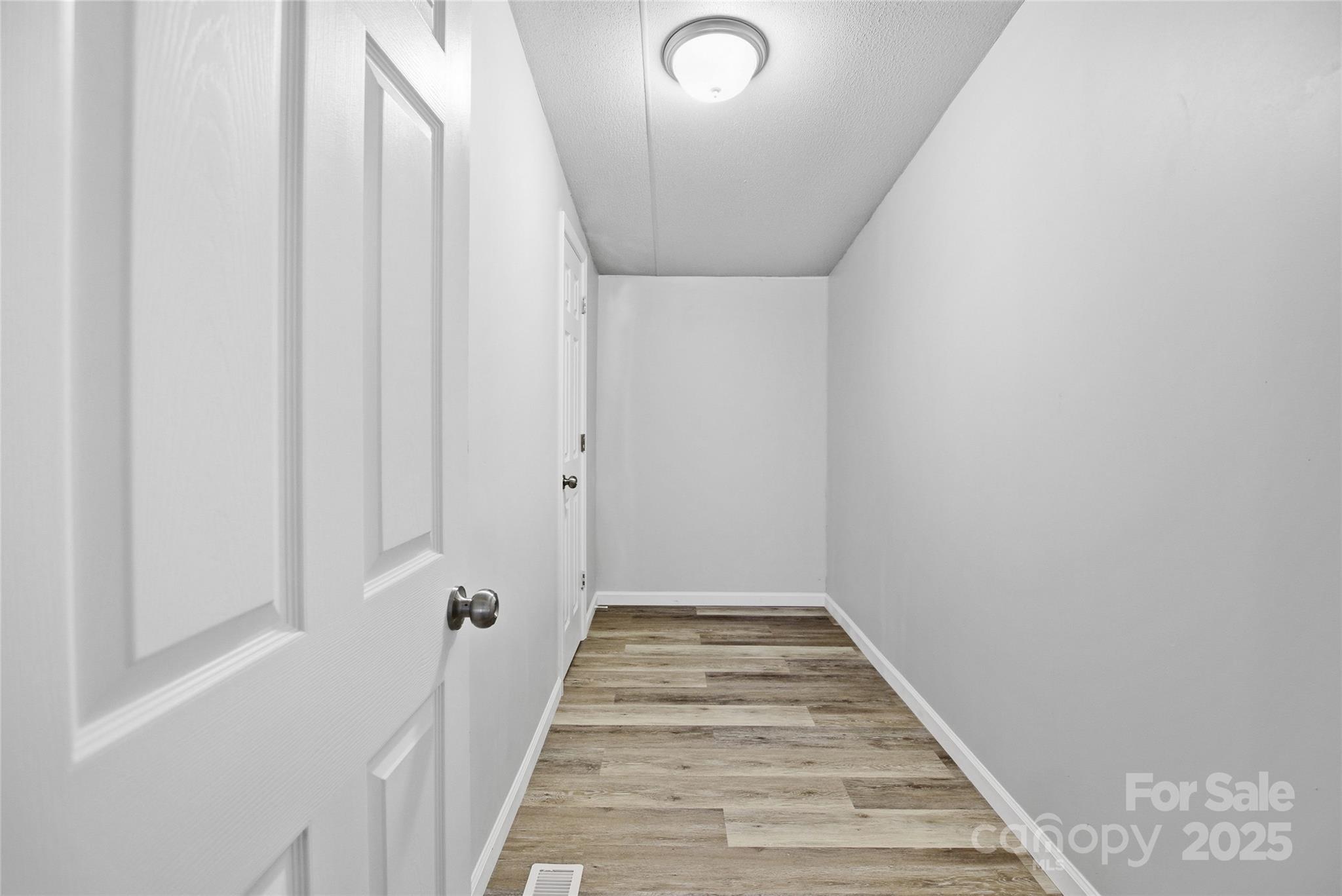 2425 Shoal Creek Church Road Shelby, NC 28152 - Photo 23 of 33 a view of a hallway with wooden floor and entryway