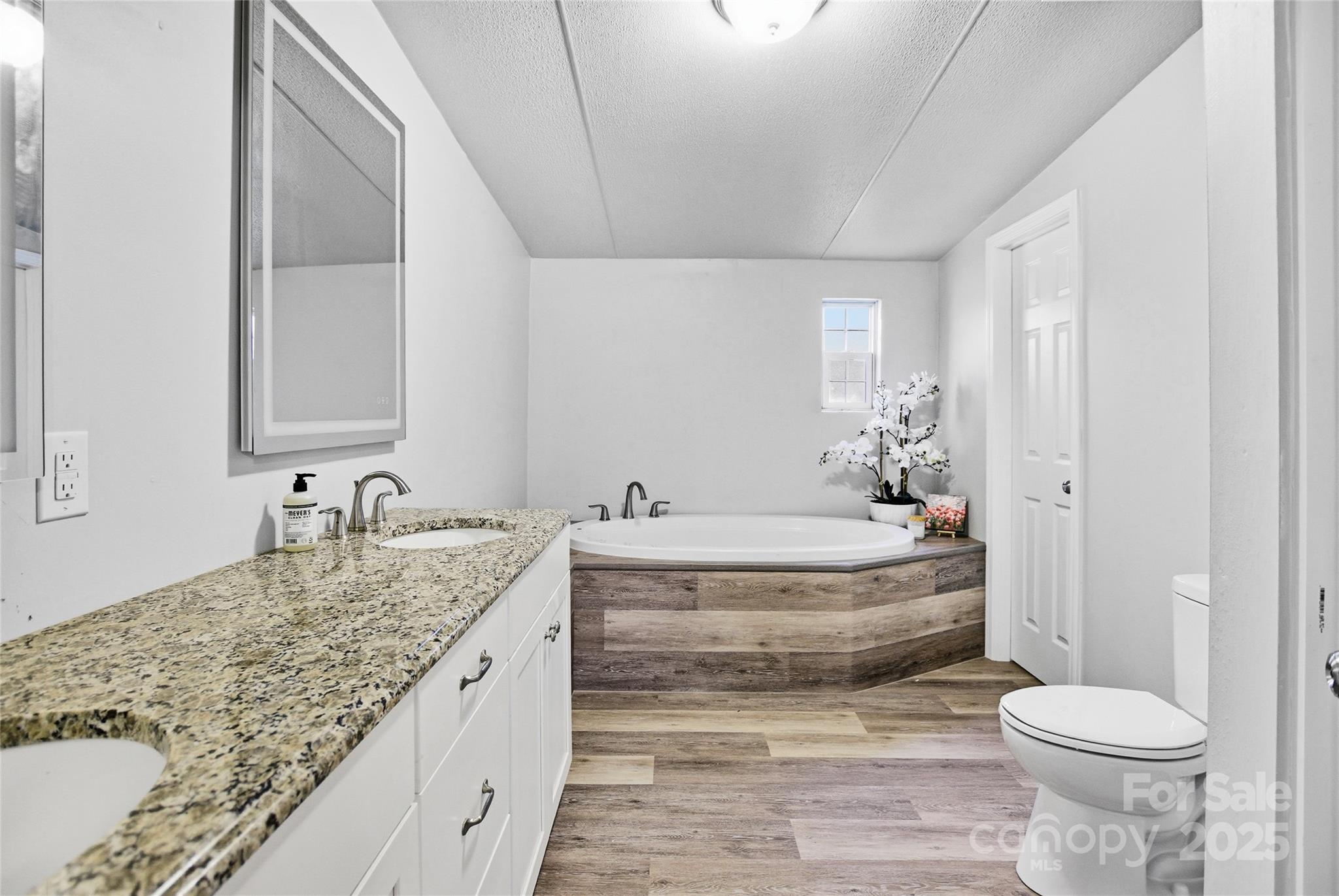 2425 Shoal Creek Church Road Shelby, NC 28152 - Photo 25 of 33 a bathroom with a granite countertop sink and a mirror