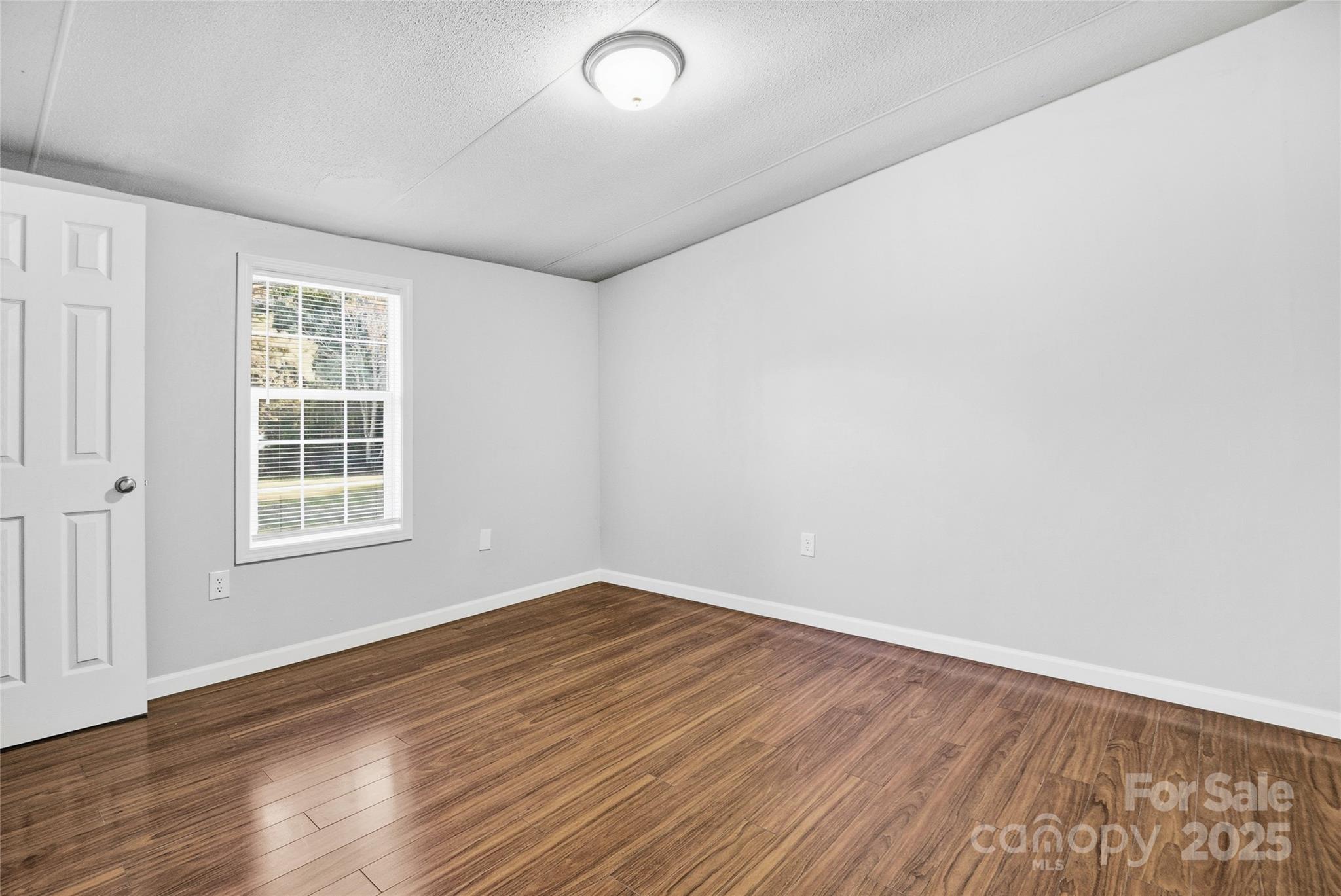 2425 Shoal Creek Church Road Shelby, NC 28152 - Photo 28 of 33 wooden floor in an empty room with a window
