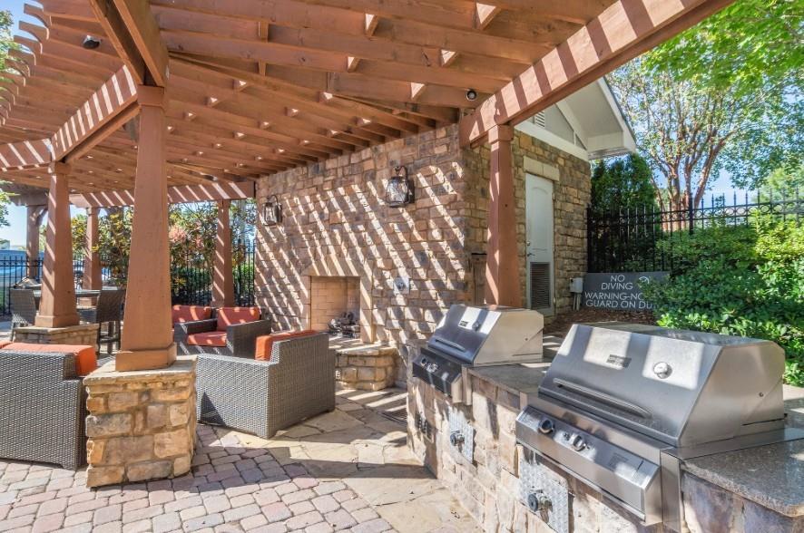 1740 Century Circle Northeast, Unit 1237 Atlanta, GA 30345 - Photo 10 of 18 a view of a patio with couches table and chairs and potted plants