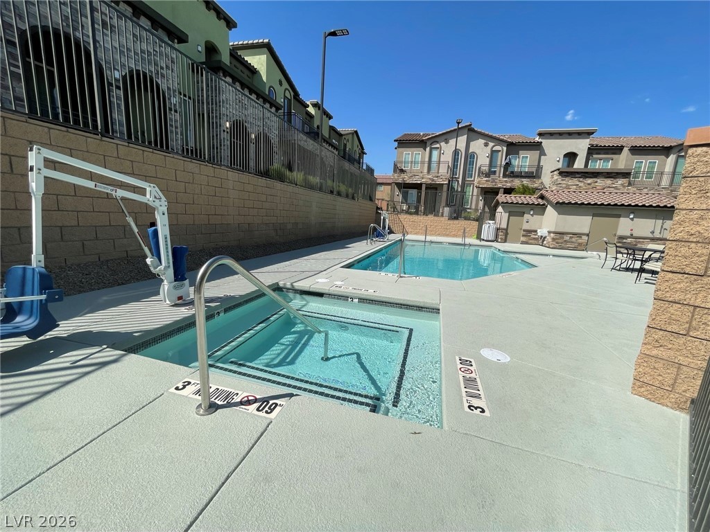 6444 Spring Jog Street Las Vegas, NV 89166 - Photo 9 of 13 An inviting outdoor pool area, perfect for relaxation and recreation under the sun.