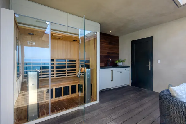 a kitchen with a refrigerator and a sink