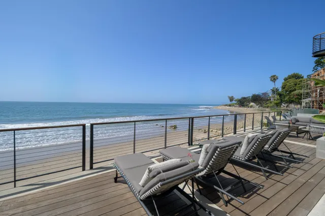 a view of a balcony with chairs