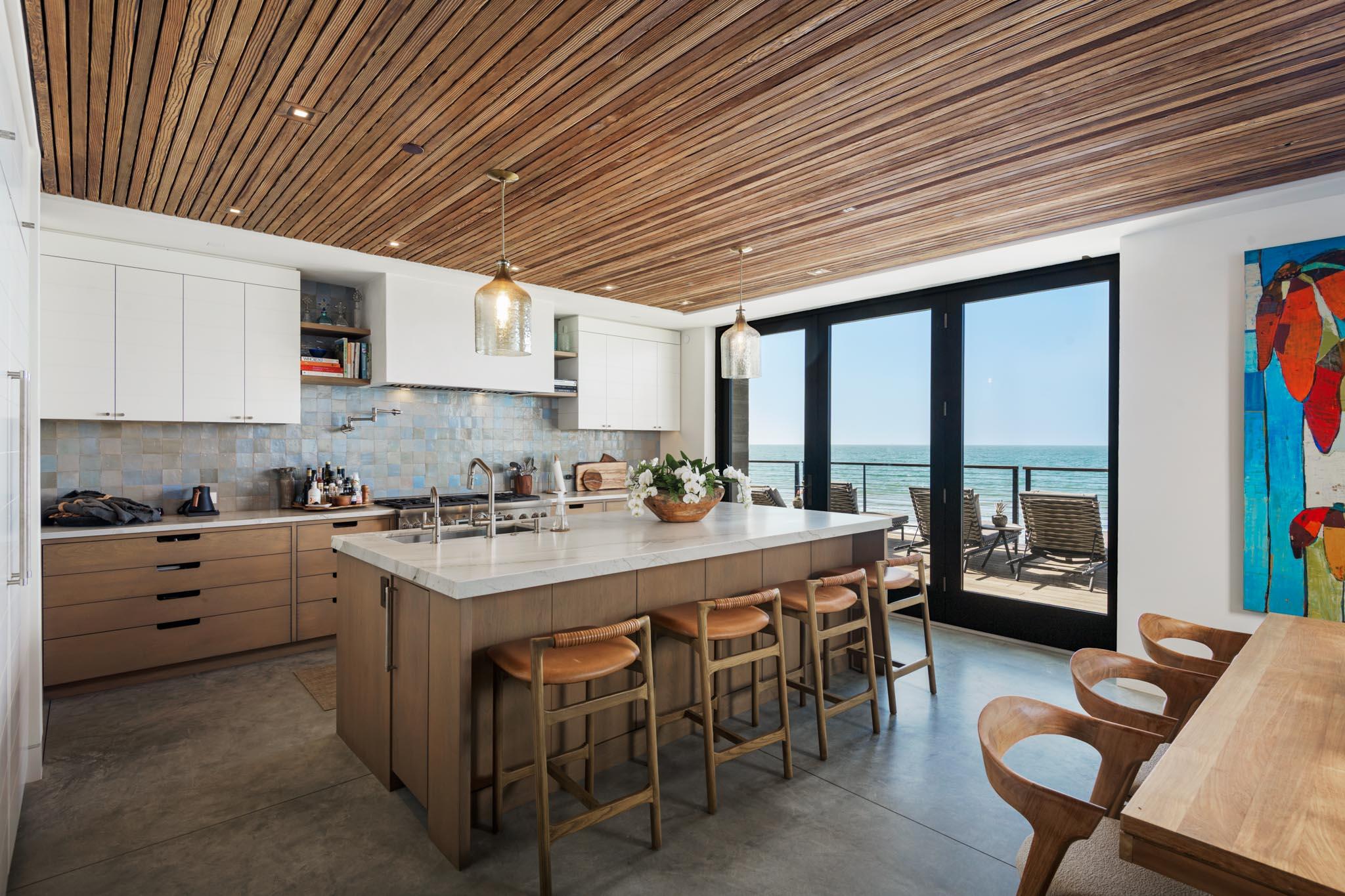 1821 Fernald Point Lane Montecito, CA 93108 - Photo 10 of 28 a large kitchen with a table and chairs